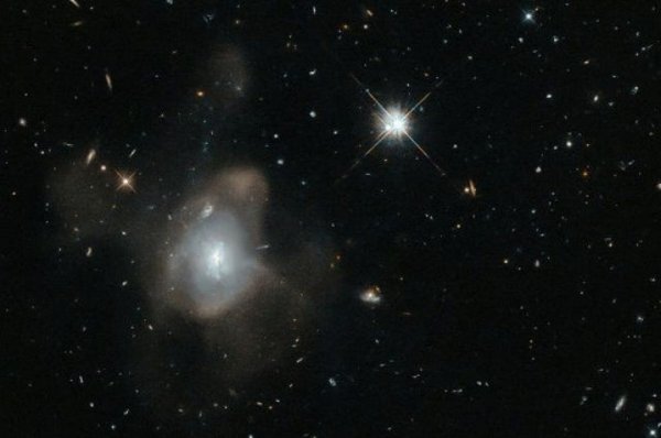 Ученые сообщили, что на окраинах спиральных галактик сливается множество черных дыр: Четыре отдельных сигнала одновременно исходили от "пожирателей"